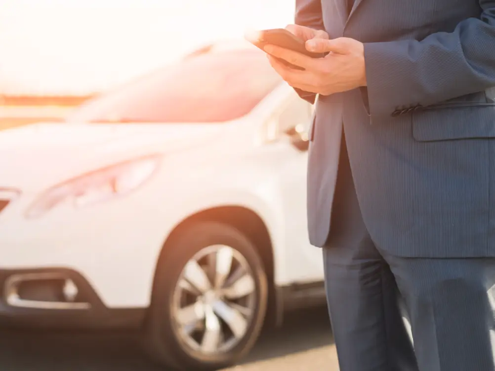 Businessman With Smartphone Front Car Cropped